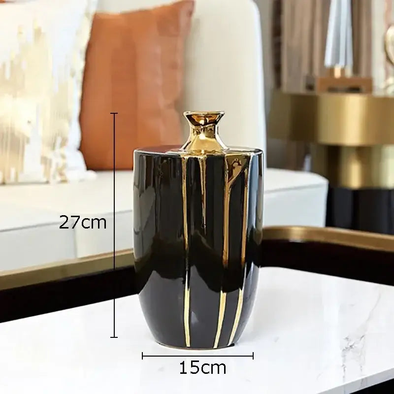 Elegant black gold ceramic vase with gold vertical stripes and golden neck for luxury living room decor, 27cm tall