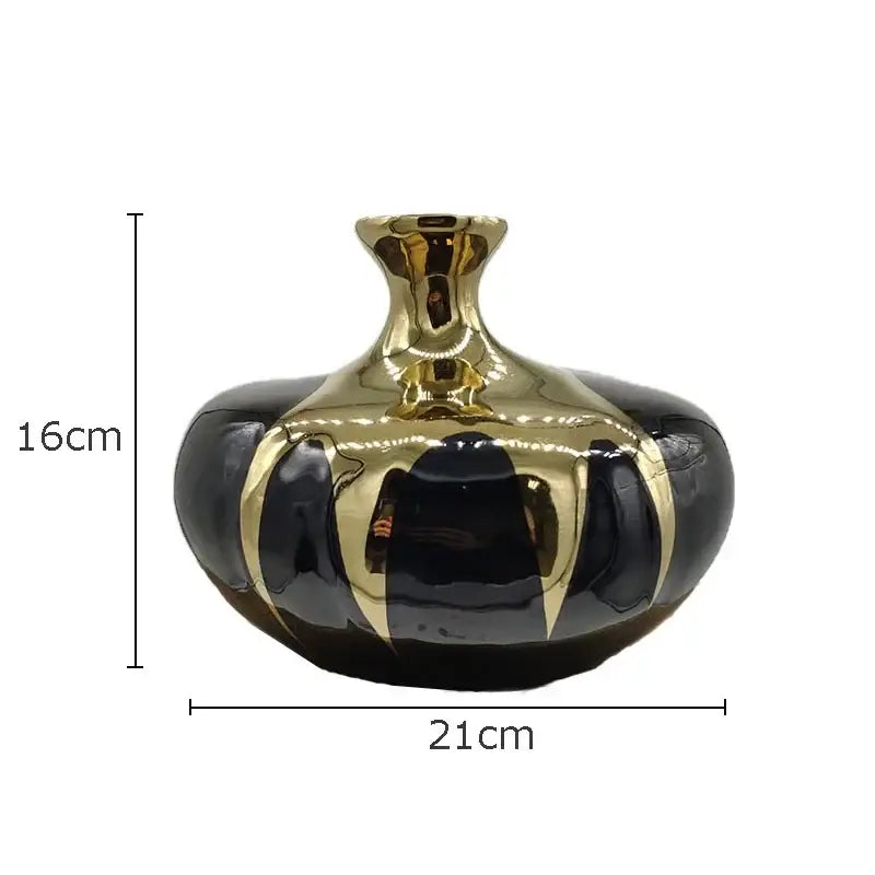 Elegant black gold ceramic vase with glossy finish and reflective metallic bands for luxury living room decor