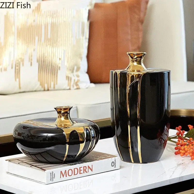 Elegant black gold ceramic vase set featuring one rounded and one tall rectangular gold ceramic vase for luxury decor