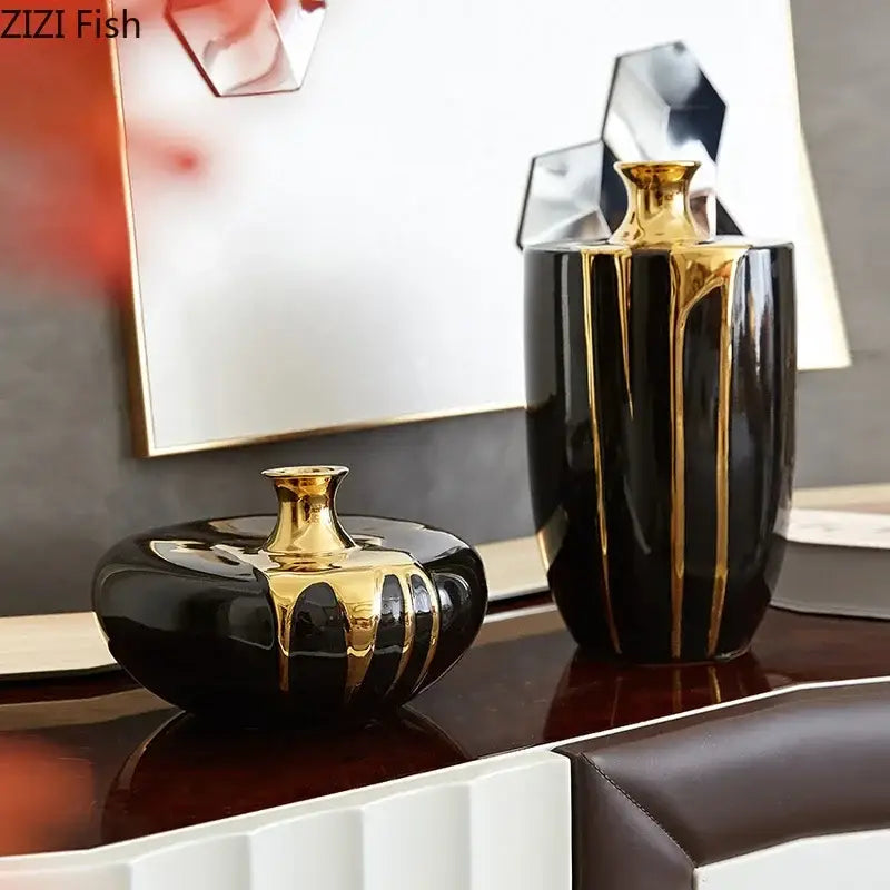 Elegant black gold ceramic vases with gold metallic drips and reflective surfaces for luxury living room decor