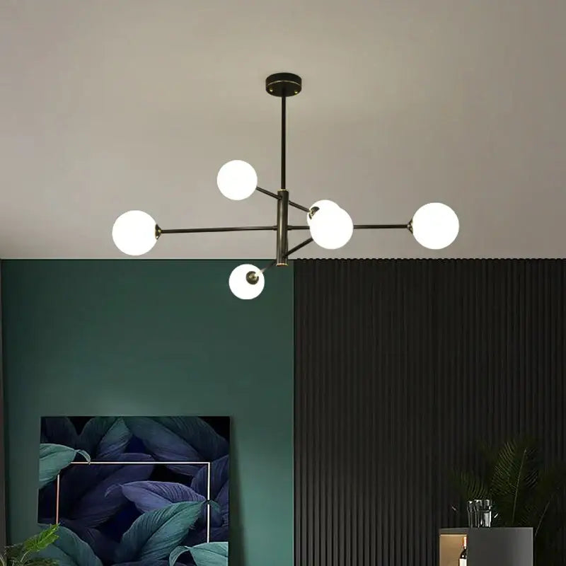 Elegant black gold glass ball chandelier with six frosted glass globe lights for modern living room lighting
