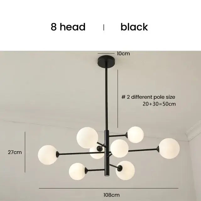 Elegant black gold glass ball chandelier with eight frosted globe lights for modern living room lighting