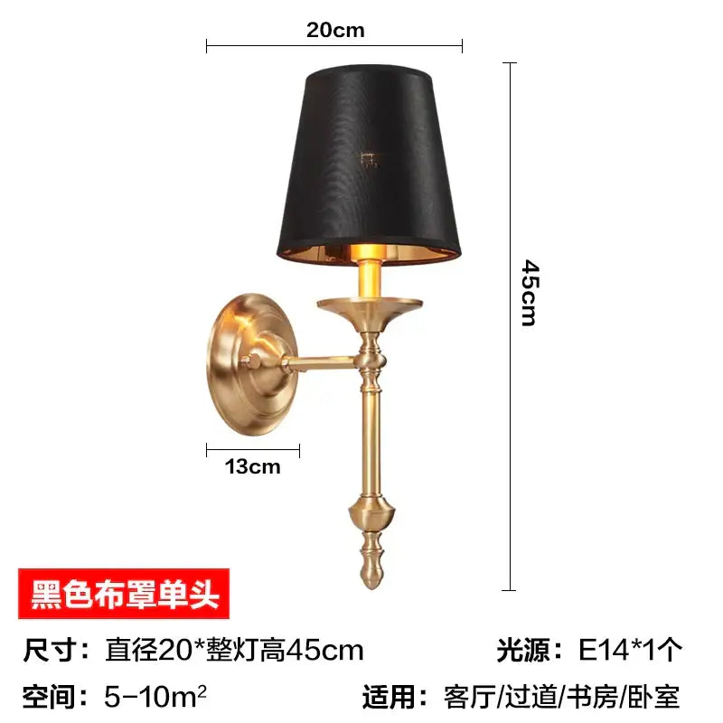 Elegant black gold wall lamp with textured black fabric shade mounted on brass-finished ornate wall sconce decorbites black gold