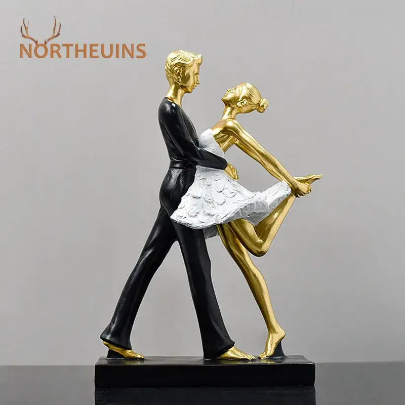 Golden and black resin dance girl double statue featuring a ballet dance girl in white tutu for living room decor