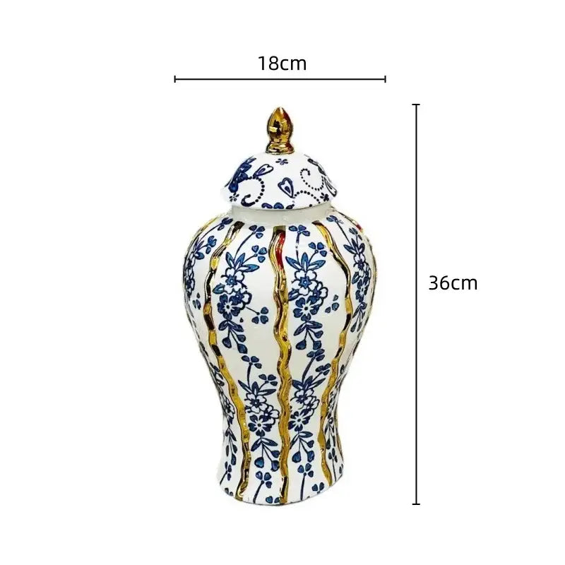 White and blue glazed ceramic ginger jar with floral patterns and gold trim for elegant living room decorbites decor