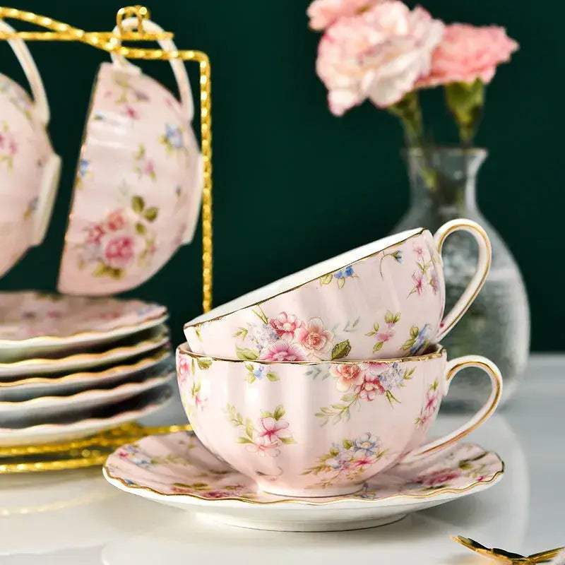 Elegant blue and pink floral porcelain tea cup set with gold trim and scalloped edges for dining room use