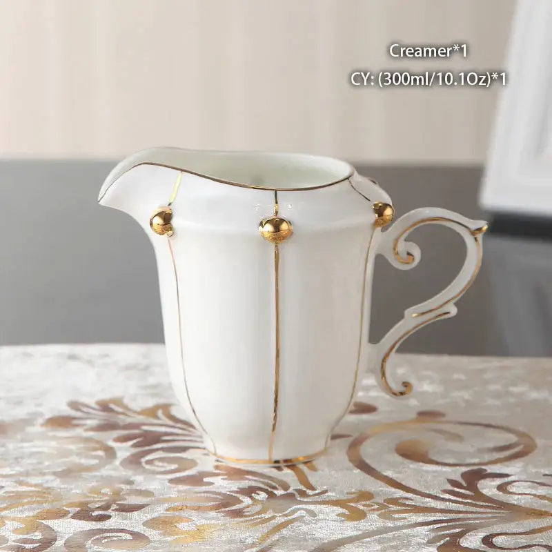 White porcelain creamer with gold trim and decorative spheres from decorbites elegant bone china tea set for dining room
