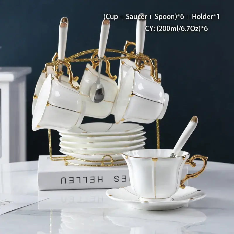 Elegant bone china tea set with gold trim and matching spoons on ornate golden stand for decorbites elegant bone china