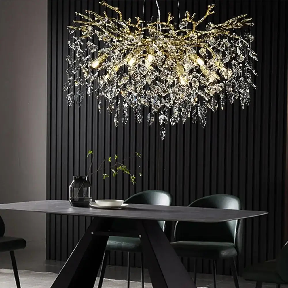Elegant golden branch pendant light with decorbites crystal suspension featuring hanging crystal leaves for dining room decor
