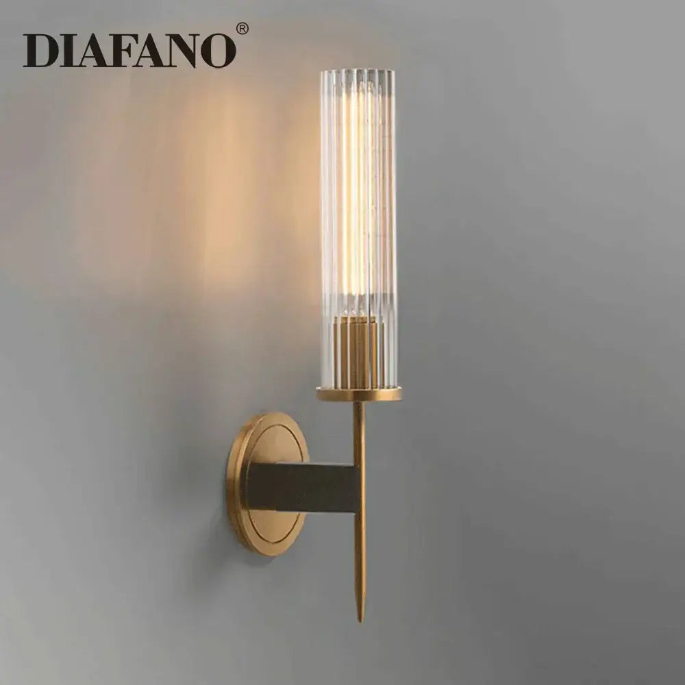 Diafano wall sconce with gold metal base and ribbed glass shade for elegant brass and black glass tube wall sconce decorbites copper wall