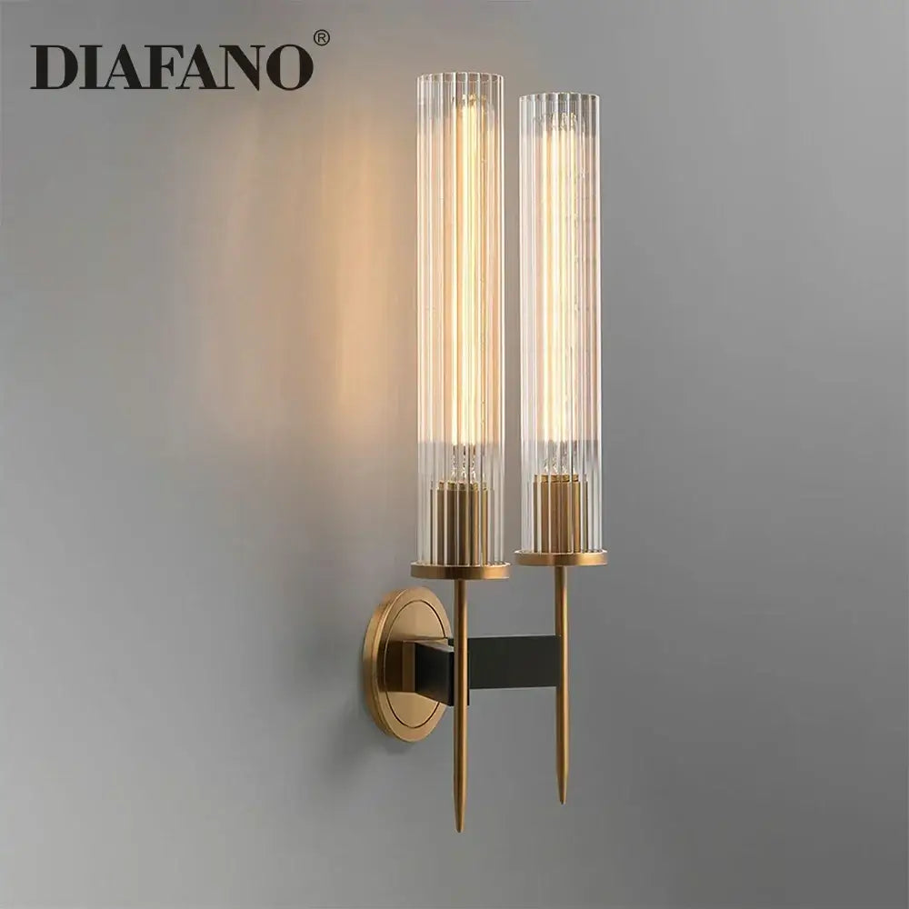 Diafano wall sconce with two vertical glass tubes brass finish and black accent bar for elegant living room decorbites copper wall sconce