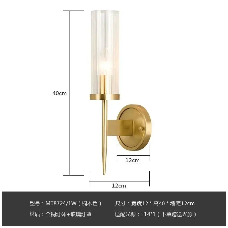 Elegant brass and black glass tube wall sconce with a brass-finished metal body and clear glass shade for living room decorbites copper wall style