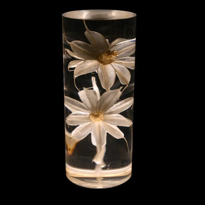 Elegant brass decorbites eternal flower desk lamp with a clear resin vase and two white daisies with golden centers