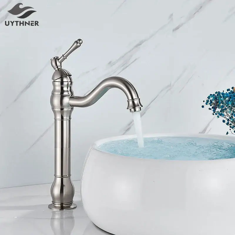 Elegant brushed nickel single handle sink faucet with stylish curved spout and decorative ridged base for bathroom use