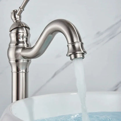 Elegant brushed nickel single handle stainless steel sink faucet with curved spout and decorative ridged accents for bathroom use