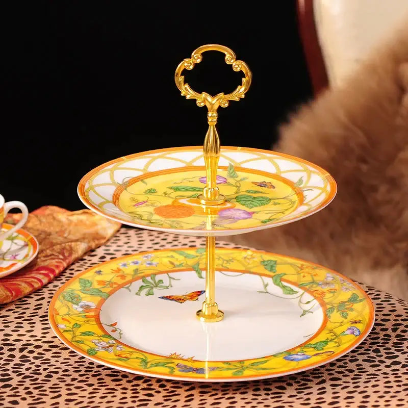 Elegant two-tiered yellow porcelain dessert stand with gold handle and botanical butterfly kitchen tableware design