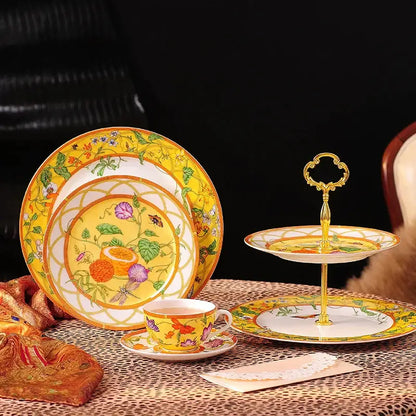 Yellow porcelain dessert stand with gold accents and floral design from elegant butterfly kitchen tableware set