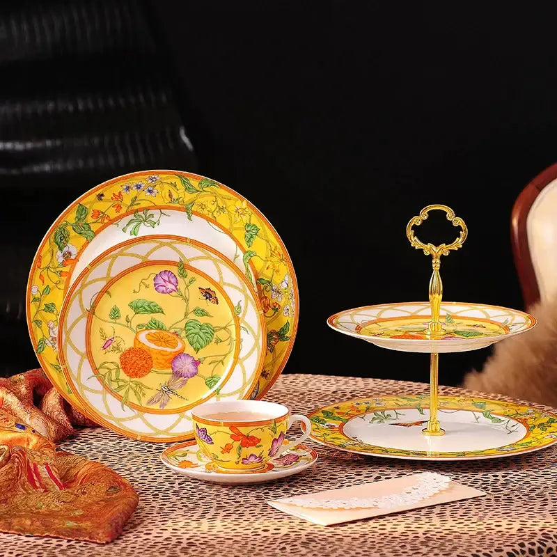 Yellow porcelain dessert stand with gold accents and floral design from elegant butterfly kitchen tableware set