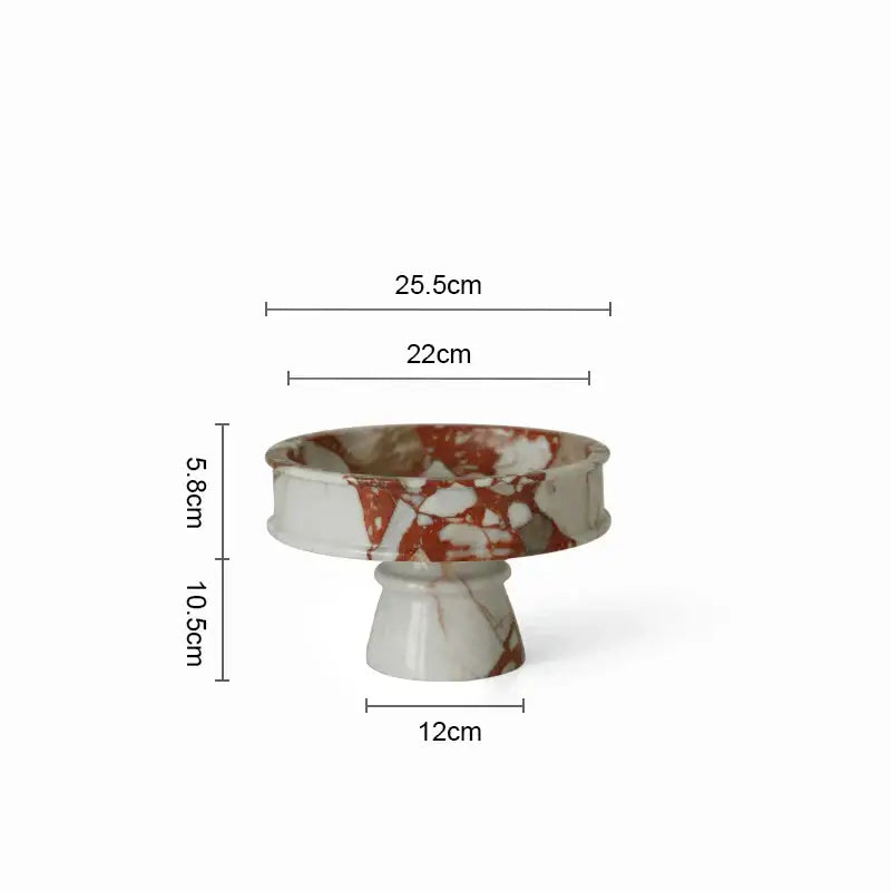 Elegant calacatta red marble vase featuring a white and rust-colored pedestal bowl with a fluted rim decorbites calacatta red