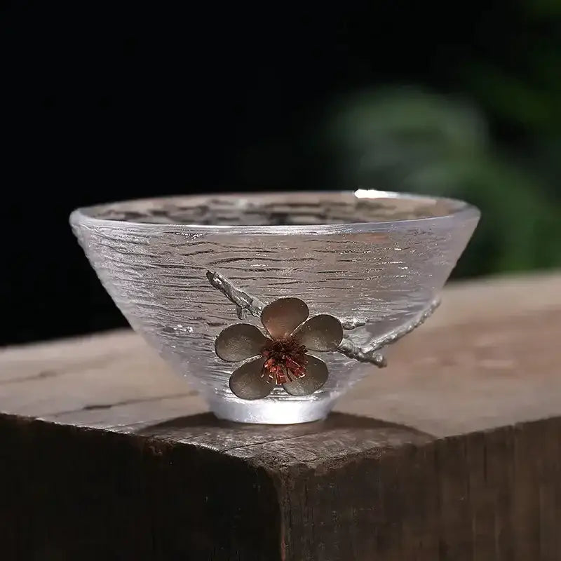 Elegant carved tin glass tea cup set featuring a translucent ripple-textured cup with silver cherry blossom decor