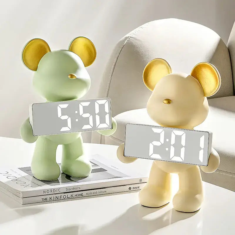 Two elegant chrome bear clock ornaments with pastel green and cream digital display and shiny gold ears for living room use