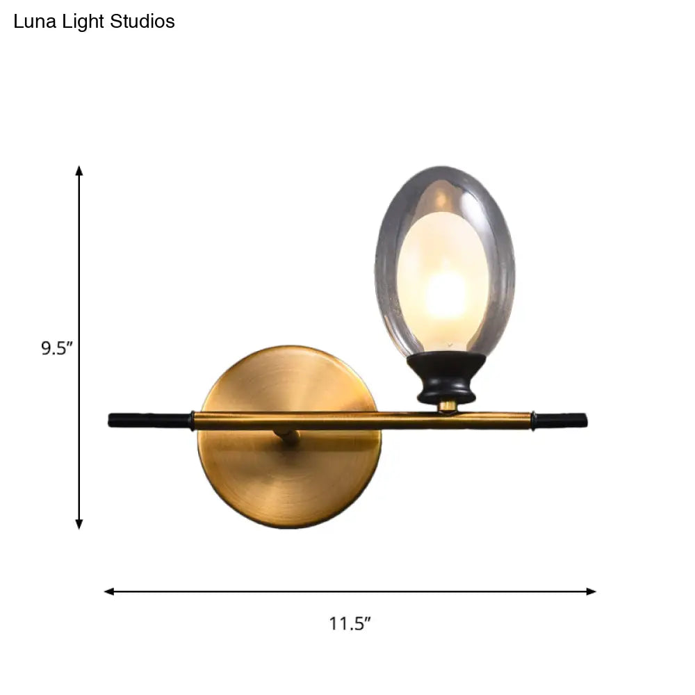 DecorBites™ DecorBites™ Elegant Clear/Amber Glass Egg Shape Wall Light - Minimalist 1 Light Brass Sconce