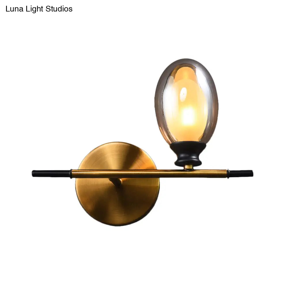 DecorBites™ DecorBites™ Elegant Clear/Amber Glass Egg Shape Wall Light - Minimalist 1 Light Brass Sconce