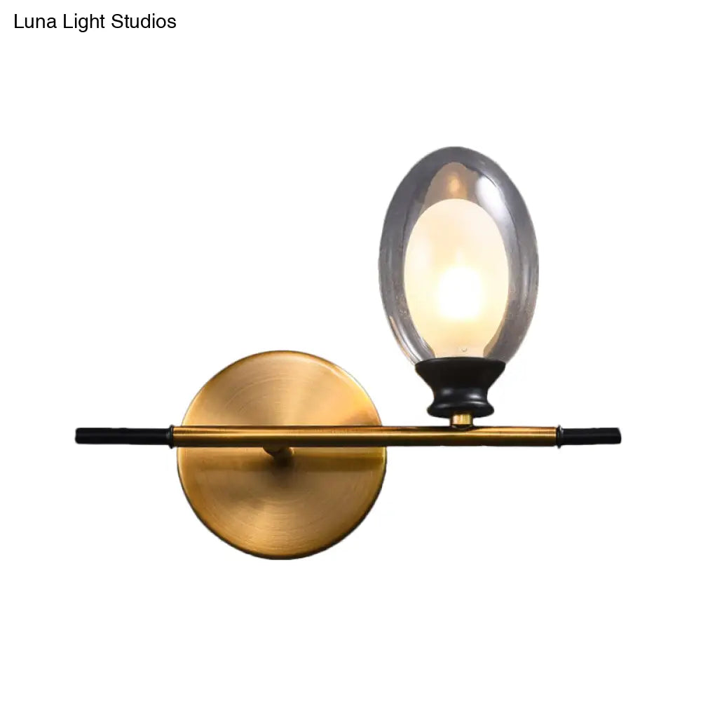 DecorBites™ DecorBites™ Elegant Clear/Amber Glass Egg Shape Wall Light - Minimalist 1 Light Brass Sconce