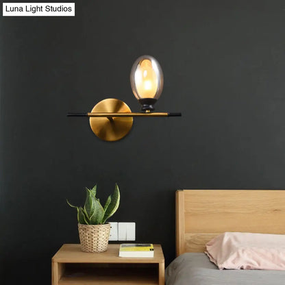 DecorBites™ DecorBites™ Elegant Clear/Amber Glass Egg Shape Wall Light - Minimalist 1 Light Brass Sconce