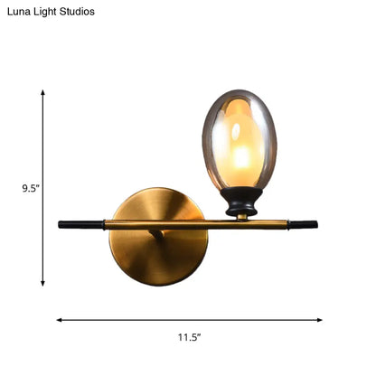 DecorBites™ DecorBites™ Elegant Clear/Amber Glass Egg Shape Wall Light - Minimalist 1 Light Brass Sconce