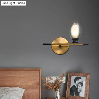 DecorBites™ DecorBites™ Elegant Clear/Amber Glass Egg Shape Wall Light - Minimalist 1 Light Brass Sconce