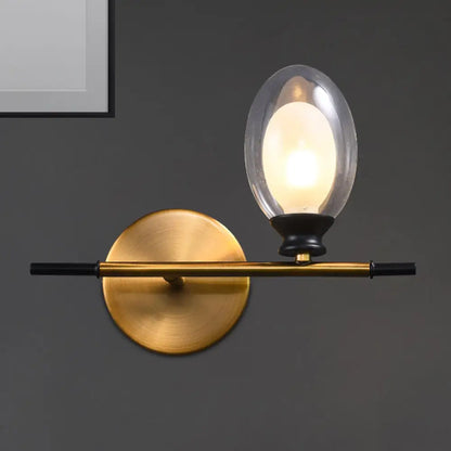 DecorBites™ DecorBites™ Elegant Clear/Amber Glass Egg Shape Wall Light - Minimalist 1 Light Brass Sconce