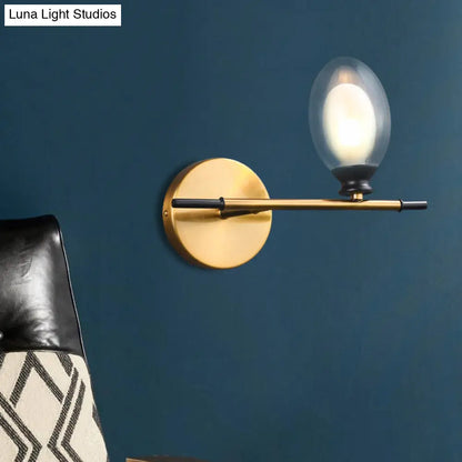 DecorBites™ DecorBites™ Elegant Clear/Amber Glass Egg Shape Wall Light - Minimalist 1 Light Brass Sconce