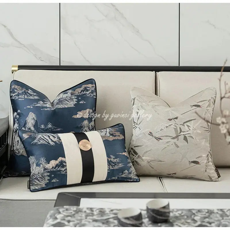 Elegant blue cushion with silver beige mountain embroidery and black white striped band featuring gold decorbites dragonfly insects embellishment