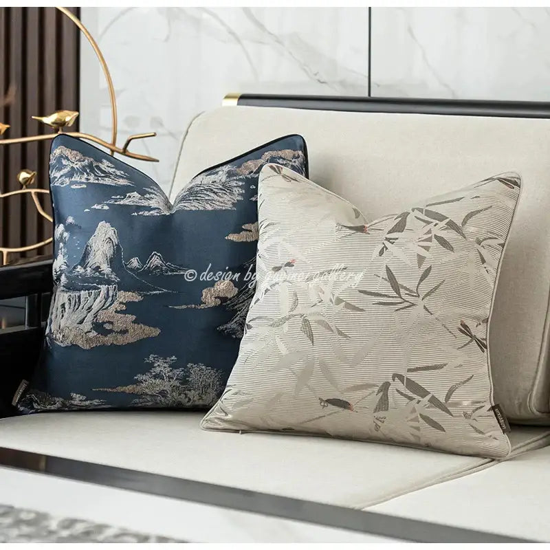 Two elegant decorative throw pillows featuring decorbites dragonfly insects embroidery in navy blue and beige fabric