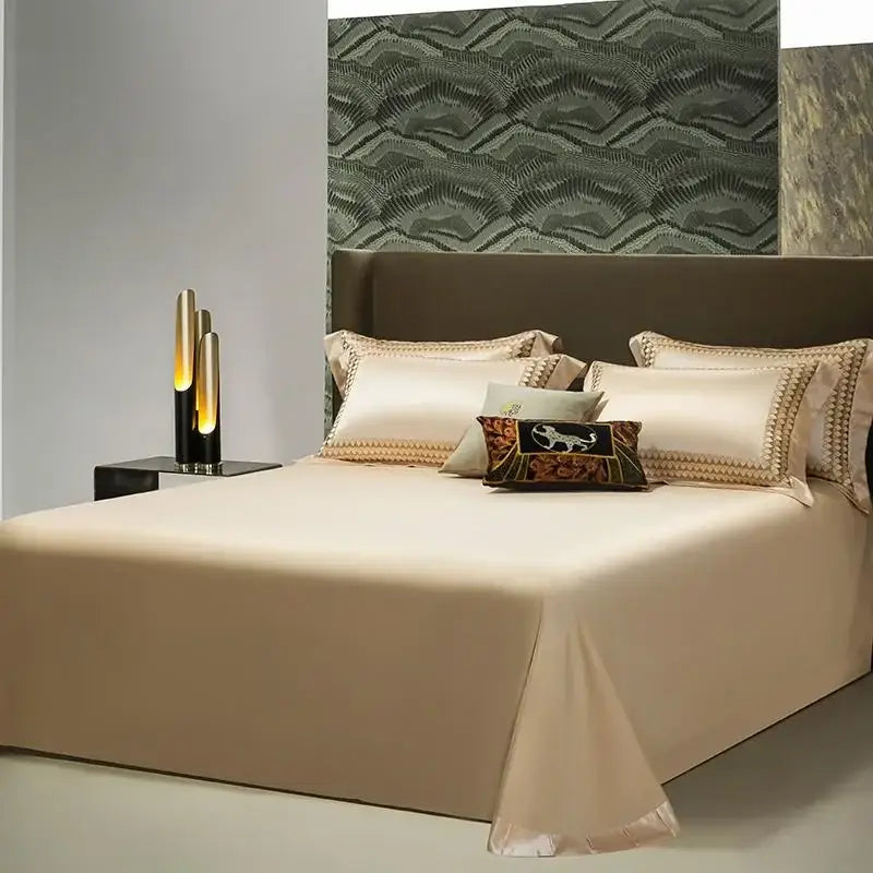 Cream-colored satin bed sheet with elegant gold embroidery edges in decorbites 1200tc egyptian cotton bedding set