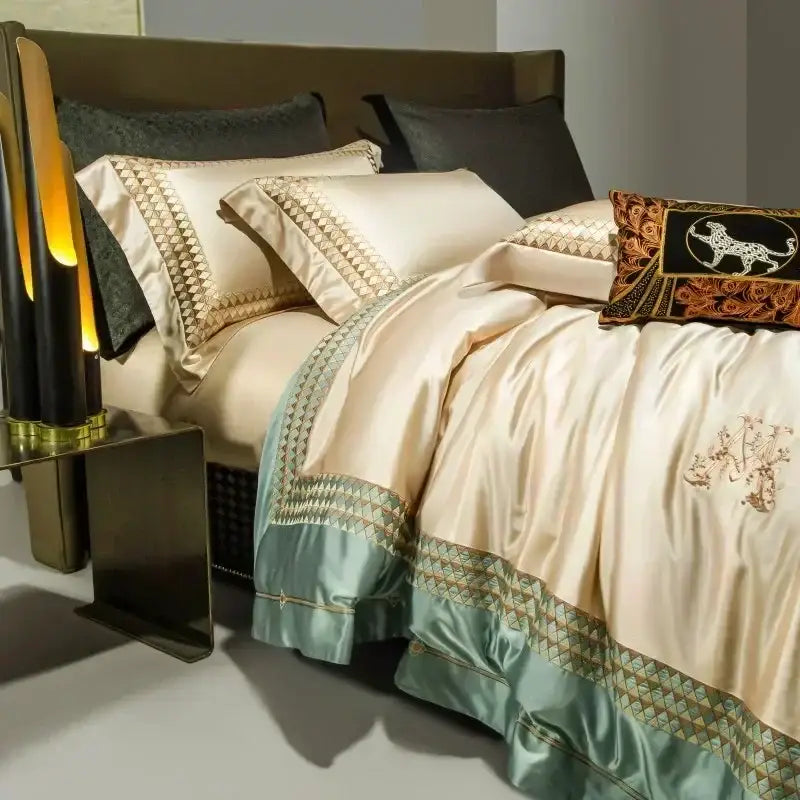 Elegant cream and teal bedding set with gold geometric embroidery and embroidered leopard pillow in decorbites 1200tc egyptian cotton