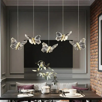 Elegant crystal butterfly pendant lamp featuring five transparent crystal butterfly pendant lights with gold centers