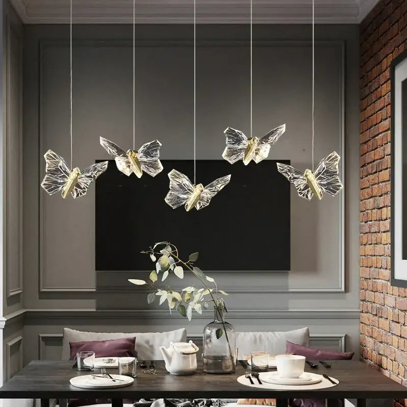 Elegant crystal butterfly pendant lamp featuring five transparent crystal butterfly pendant lights with gold centers