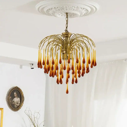 Golden brass decorbites elegant crystal ceiling chandelier with amber and clear glass teardrop pendants for dining room