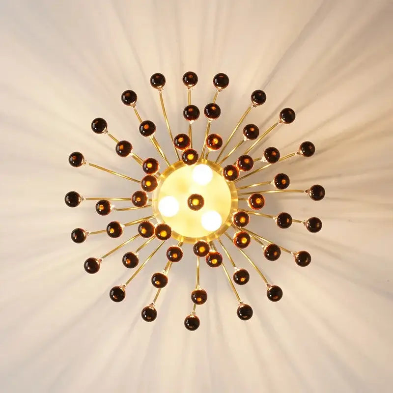 Elegant crystal ceiling chandelier with golden sunburst design amber glass orbs and central illuminated panel for dining room decorbites elegant crystal