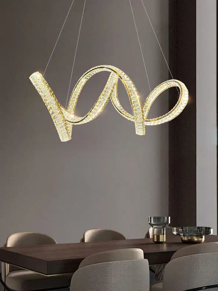 Gold-toned crystal-encrusted modern chandelier with sleek intertwined loop design by decorbites elegant crystal for living room decor