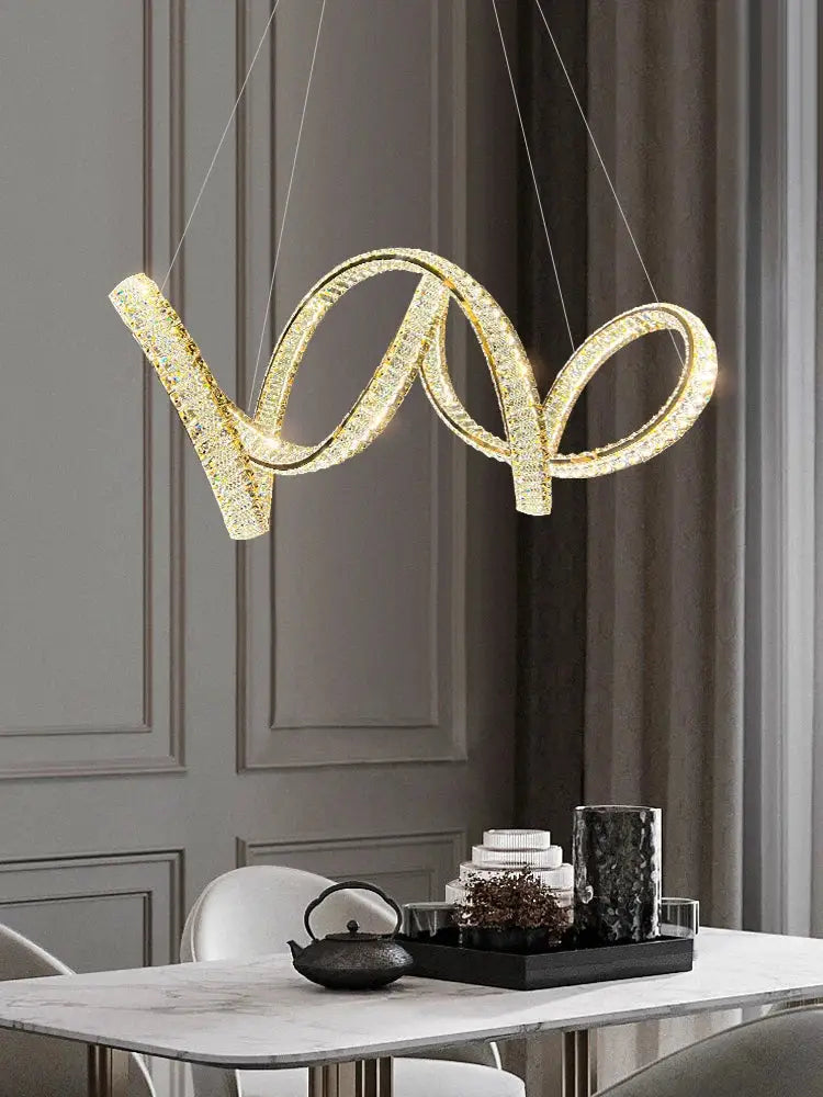 Elegant crystal chandelier by decorbites featuring a modern gold spiral design with crystal encrusted decor for living room