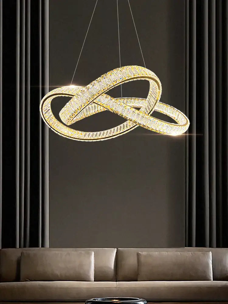 Golden infinity-shaped decorbites elegant crystal chandelier with embedded crystals and sleek modern design for living room