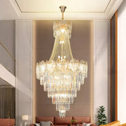 Elegant crystal duplex chandelier with cascading clear glass prisms and gold accents in modern living room decorbites elegant crystal