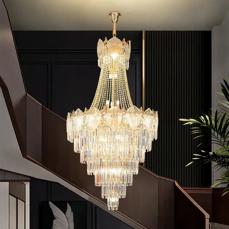 Elegant crystal duplex chandelier featuring gold-toned metal frame and cascading clear glass prisms for decorbites elegant crystal decor