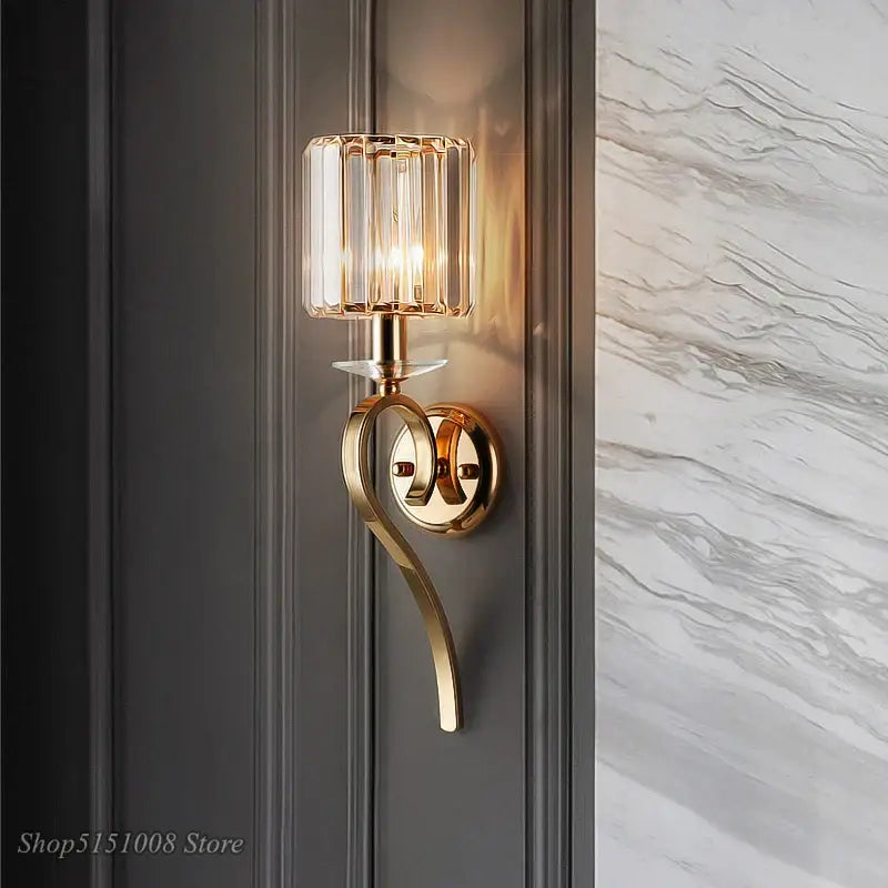 Elegant crystal gold wall lamp with gold-toned curved arm and cylindrical glass shade for bedroom decorbites crystal gold