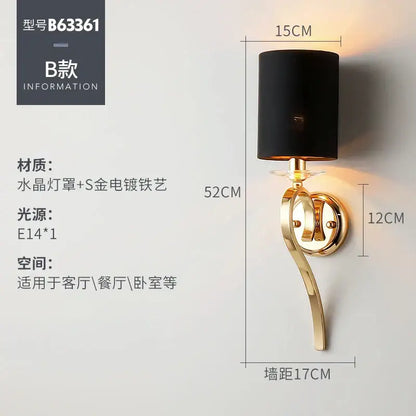 Elegant crystal gold wall lamp featuring a gold-plated wrought iron frame and black cylindrical fabric shade for bedroom decorbites crystal gold wall lighting