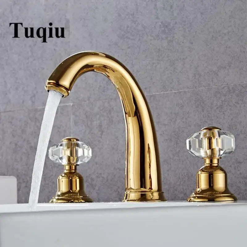 Elegant crystal handle gold basin faucet with gold finish and crystal knobs featuring a sleek curved spout for bathroom use