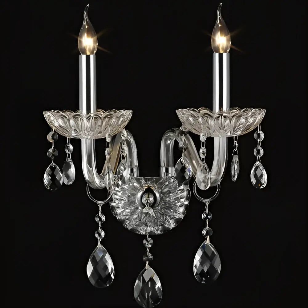 Elegant crystal lamp wall light with clear glass arms, two lit candle bulbs, and teardrop crystals for bedroom decorbites crystal lamp
